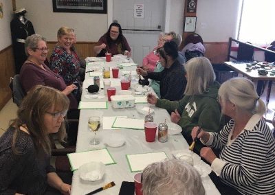 OK Falls Legion paint party group around table
